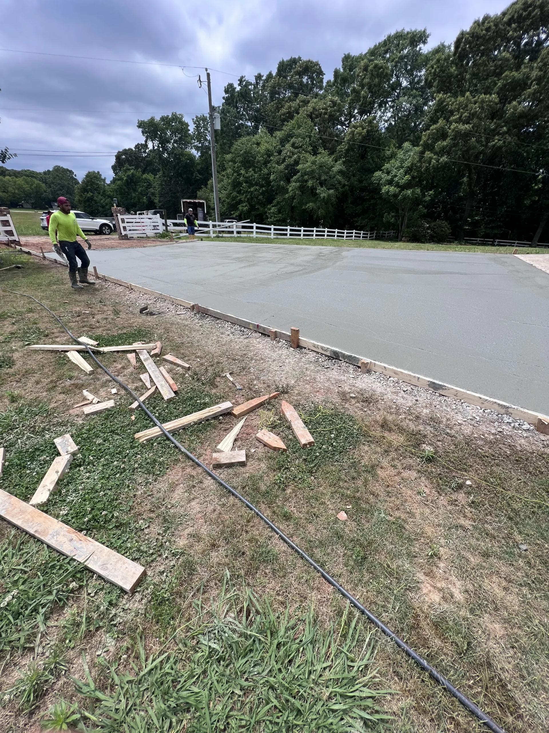 Newly poured large concrete slab with wooden forms