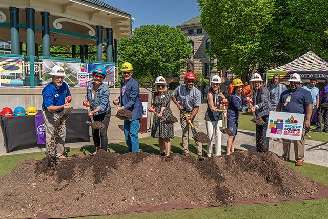 Groundbreaking ceremony with shovels and hard hats at Decatur Square in Decatur GA
