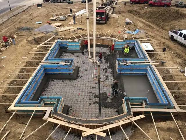 Concrete foundation pouring and rebar installation on site